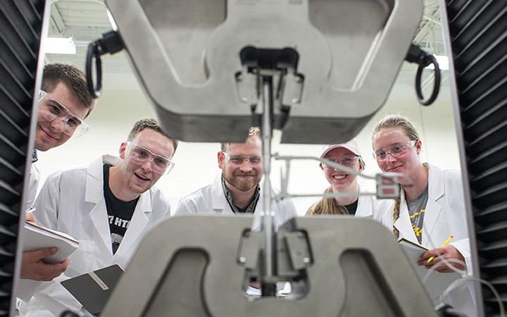 Students observing machinery